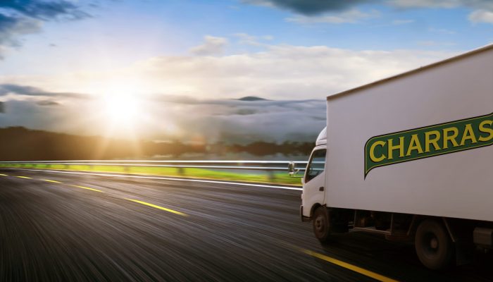Truck traveling on road at sunrise – speed and delivery concept. Truck traveling on road at sunrise - speed and delivery concept.
